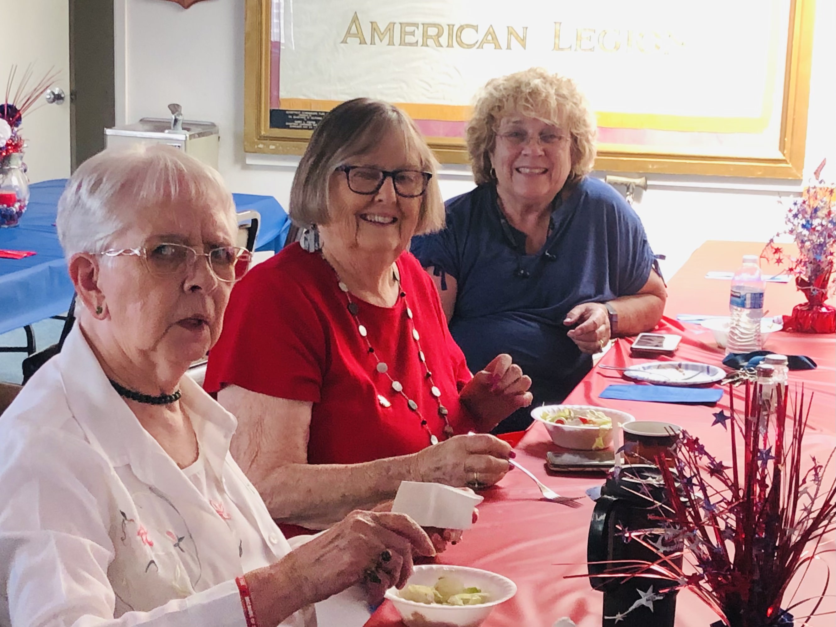 Community members celebrating Memorial Day at American Legion Post 6 with patriotic decorations