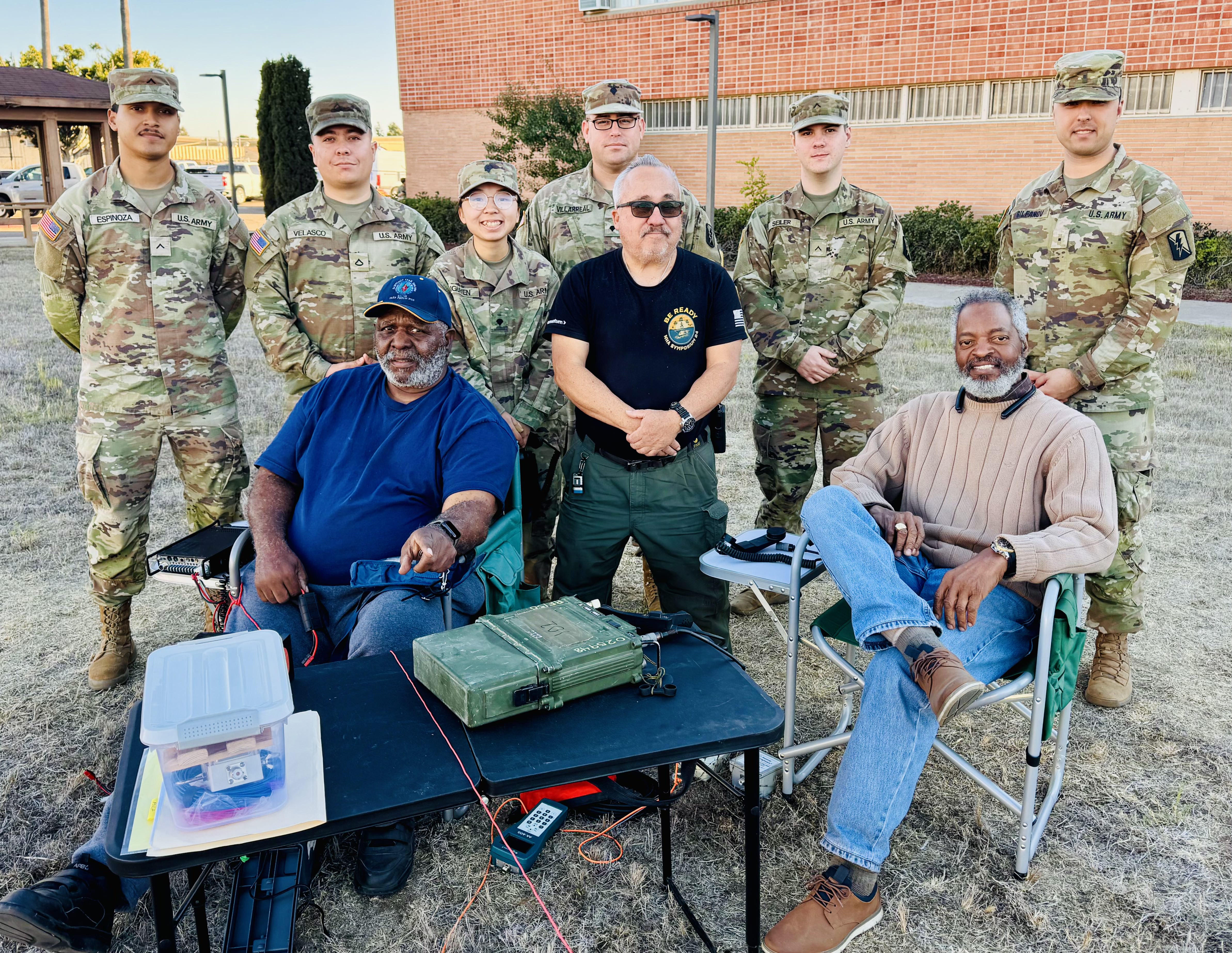 Amateur Radio Club veterans posing with active duty soldiers during military communications training exercise